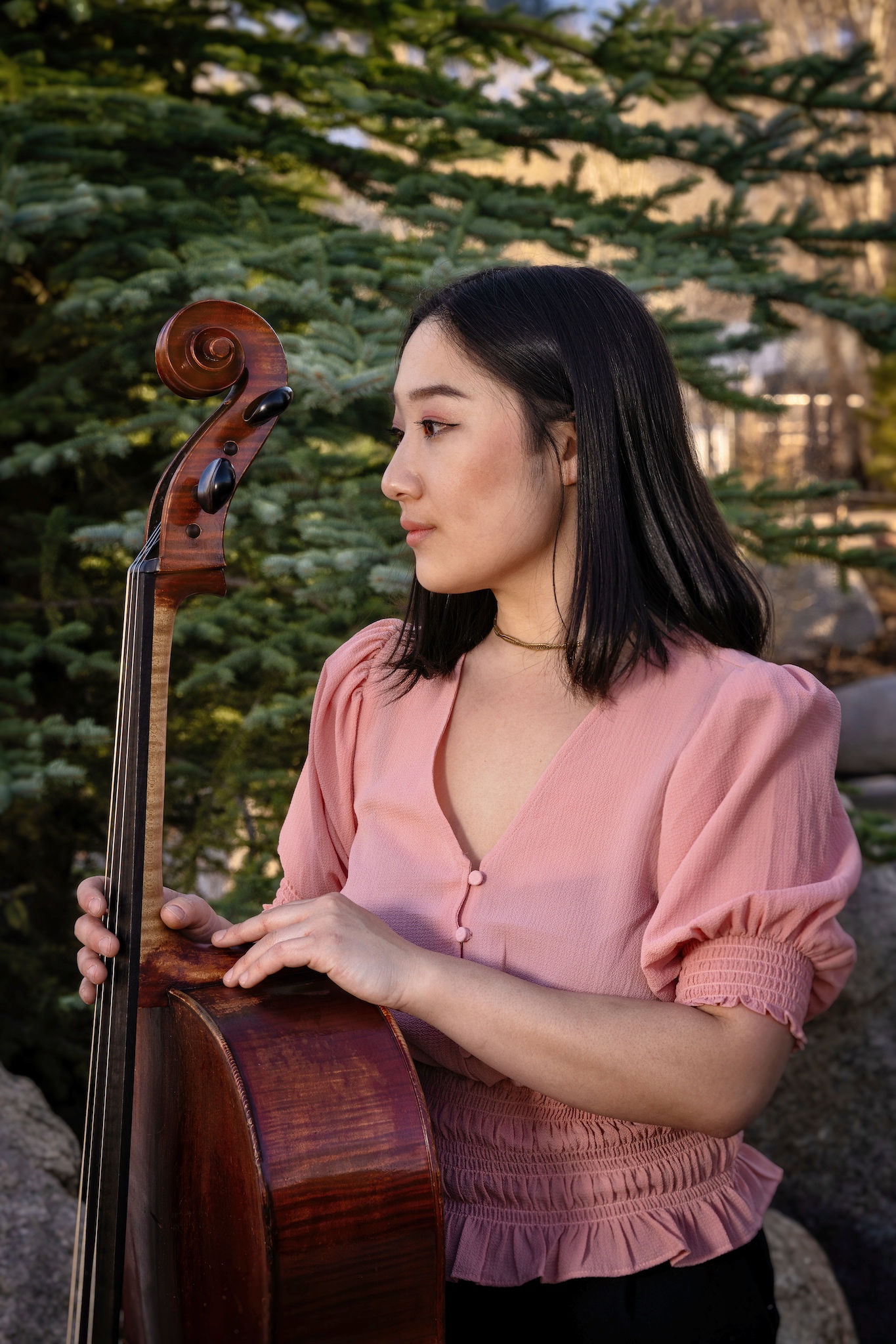 Portrait of Erica Ogihara, in front of a cedar tree